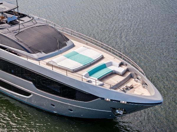 Slide: The Image of Luxurious 2024 Riva 102 Corsaro Super yacht with elegant deck design on water. - 23