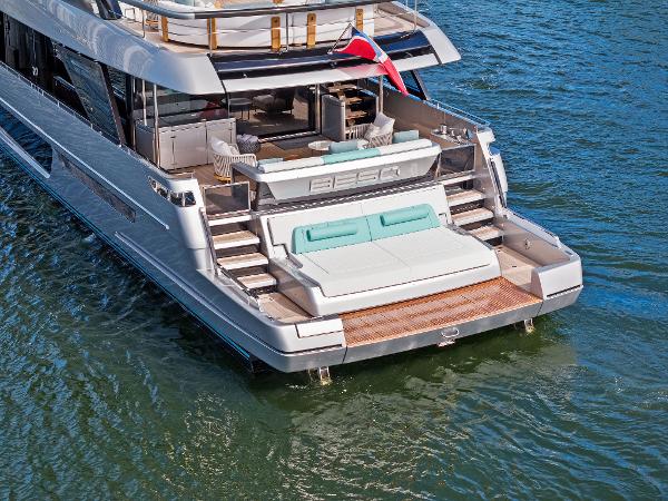 Slide: The Image of 2024 Riva 102 Corsaro Super yacht with luxurious deck and seating on water. - 25