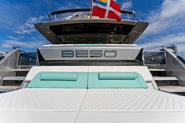Slide: The Image of 2024 Riva 102 Corsaro Super yacht with sun deck and flags. - 28