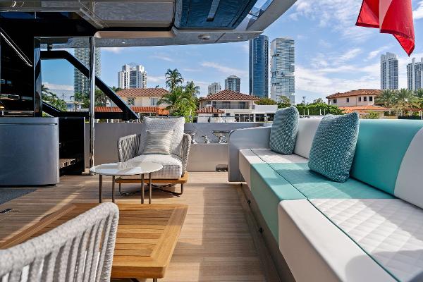 Slide: The Image of Luxurious deck of 2024 Riva 102 Corsaro Super yacht with city skyline view. - 33