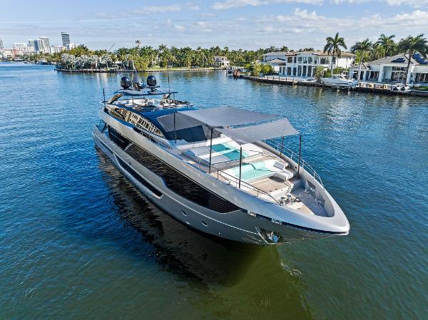 Slide: The Image of Luxurious 2024 Riva 102 Corsaro Super yacht cruising in scenic waterfront setting. - 4