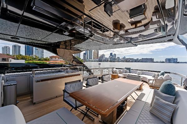 Slide: The Image of Luxurious 2024 Riva 102 Corsaro Super yacht deck with city skyline view. - 48