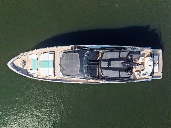 Slide: The Image of Aerial view of 2024 Riva 102 Corsaro Super luxury yacht on water. - 8