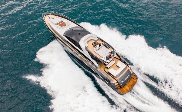 Slide: The Image of 2017 Riva 88 Domino Super yacht cruising on open water. - 10