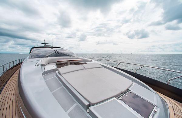 Slide: The Image of 2017 Riva 88 Domino Super yacht on open sea under cloudy sky. - 12
