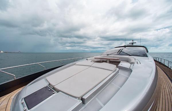 Slide: The Image of 2017 Riva 88 Domino Super yacht on open water under cloudy sky. - 14