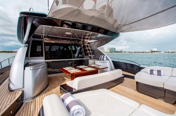 Slide: The Image of Luxury deck of 2017 Riva 88 Domino Super yacht with elegant seating and dining area. - 19