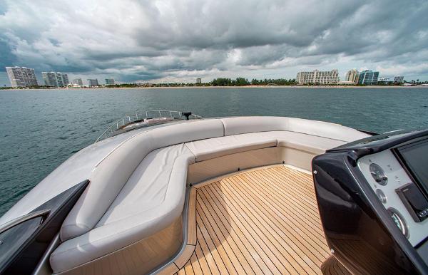 Slide: The Image of Luxurious 2017 Riva 88 Domino Super yacht with spacious deck and scenic coastal view. - 21