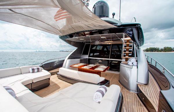 Slide: The Image of 2017 Riva 88 Domino Super yacht with luxurious deck and seating area. - 24