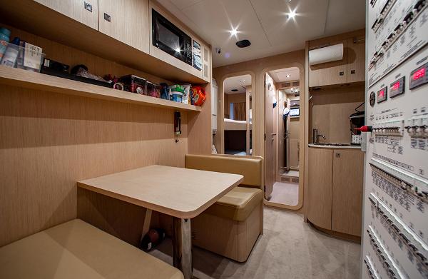 Slide: The Image of Interior of 2017 Riva 88 Domino Super yacht with dining area and control panels. - 45