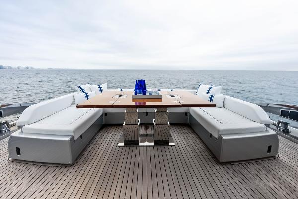 Slide: The Image of Luxury deck seating on 2021 Riva 88' FOLGORE yacht with ocean view. - 11