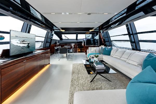 Slide: The Image of Luxurious interior of 2021 Riva 88' FOLGORE yacht with modern furnishings and panoramic windows. - 28