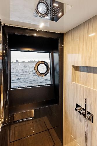 Slide: The Image of Modern bathroom on the 2021 Riva 88' FOLGORE yacht with ocean view. - 43
