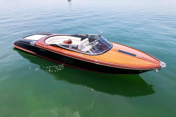 Slide: The Image of 2020 Riva Aquariva Super luxury speedboat on calm water. - 0