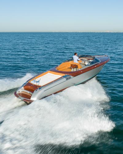 Slide: The Image of 2020 Riva Aquariva Super luxury speedboat cruising on open water. - 5