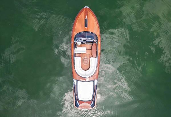 Slide: The Image of Aerial view of a 2020 Riva Aquariva Super luxury boat on water. - 8