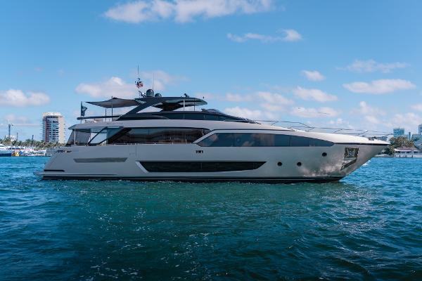 Slide: The Image of 2019 Riva ARGO yacht cruising on blue water under a clear sky. - 0