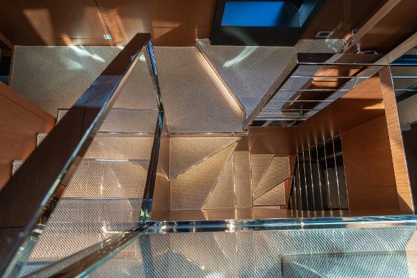 Slide: The Image of Luxurious staircase inside 2019 Riva ARGO yacht, featuring sleek design and modern materials. - 10