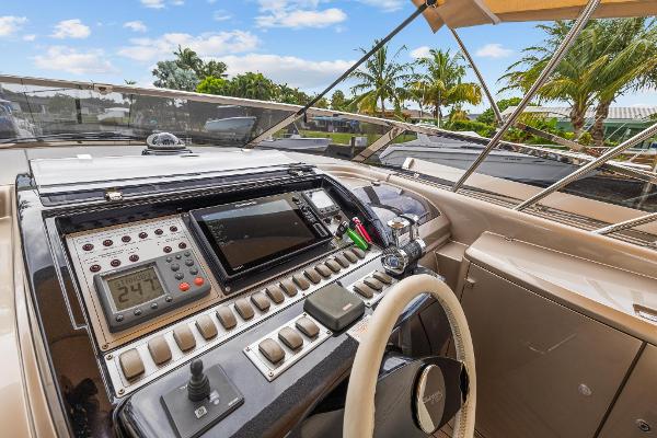 Slide: The Image of 2010 Riva Rama yacht cockpit with navigation controls and tropical background. - 10