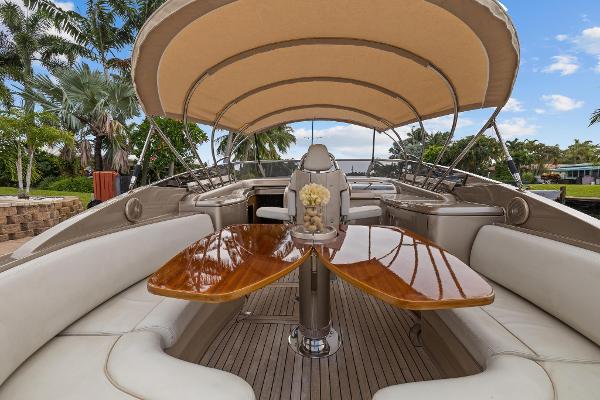 Slide: The Image of Luxurious 2010 Riva Rama boat with elegant seating and wooden table under canopy. - 15
