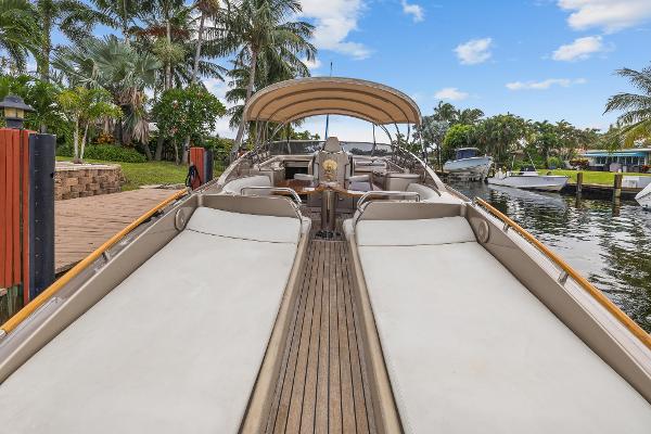 Slide: The Image of Luxury 2010 Riva Rama yacht docked, featuring spacious sunbeds and elegant design. - 16