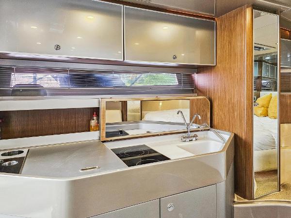 Slide: The Image of Modern kitchen area in 2010 Riva Rama yacht with sleek cabinetry and integrated appliances. - 21