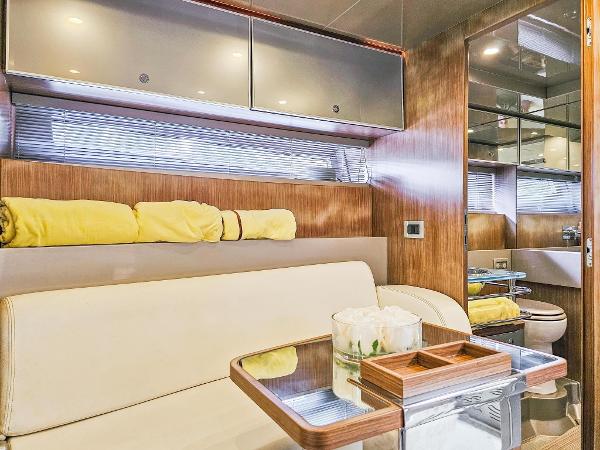 Slide: The Image of Interior of 2010 Riva Rama yacht with modern furnishings and wooden accents. - 22