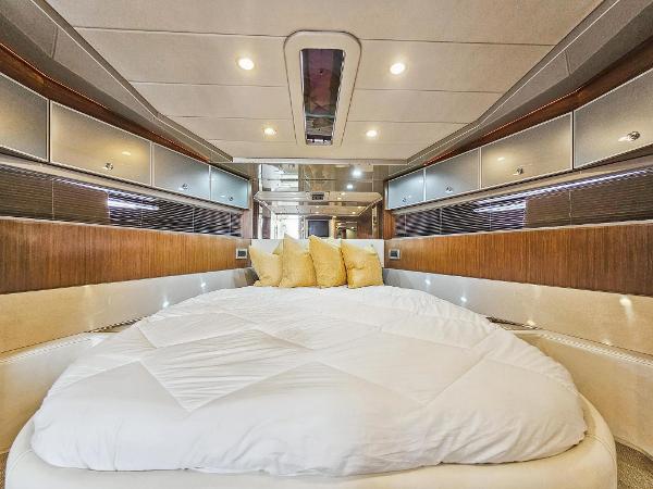 Slide: The Image of Luxurious bedroom interior of 2010 Riva Rama yacht with modern design and cozy bedding. - 23