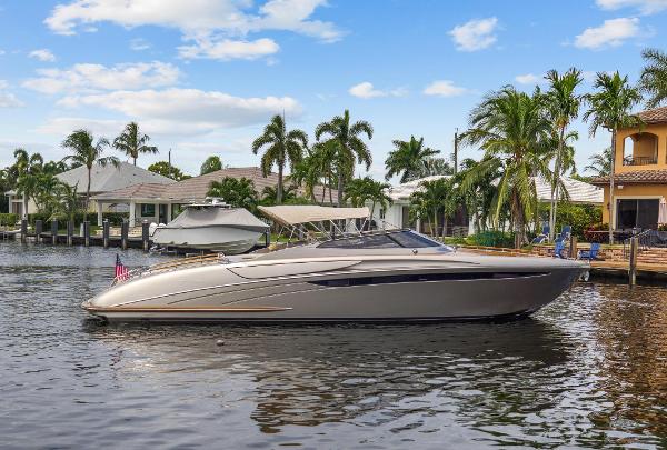 Slide: The Image of 2010 Riva Rama boat docked in a tropical marina with palm trees. - 3