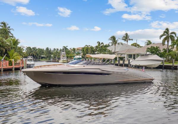 Slide: The Image of Riva Rama 2010 luxury yacht docked in a tropical marina with palm trees. - 6