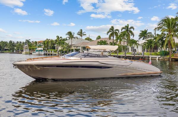 Slide: The Image of 2010 Riva Rama boat cruising on a sunny day near waterfront homes. - 8