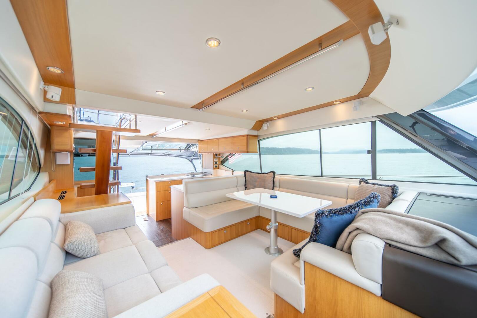 Slide: The Image of 2015 Riviera 50 Enclosed Bridge - EVOLUTION Salon Looking Aft - 4742305