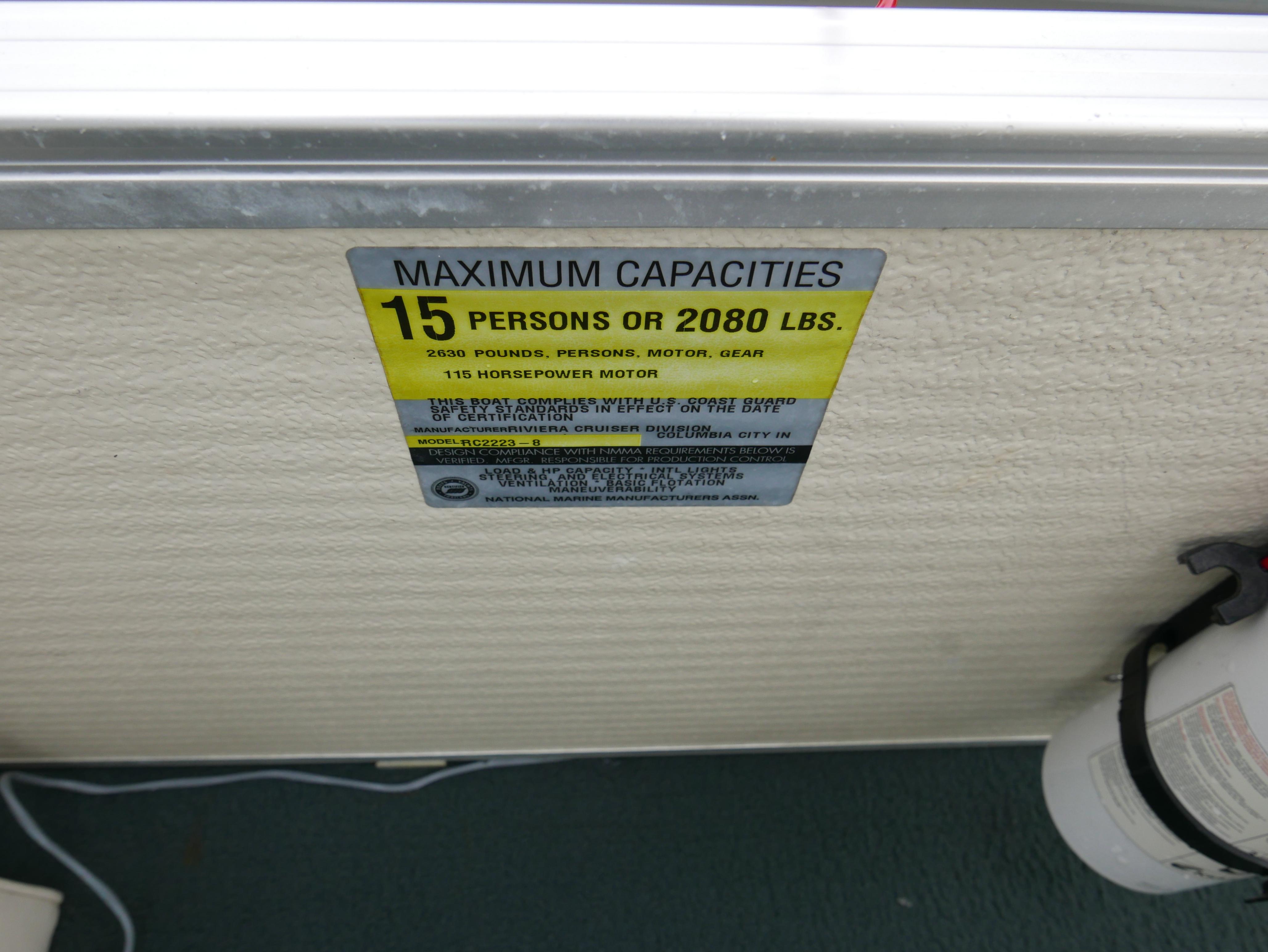 Slide: The Image of Capacity label on 2000 Riviera Cruiser, max 15 people or 2080 lbs, 115 HP motor. - 12