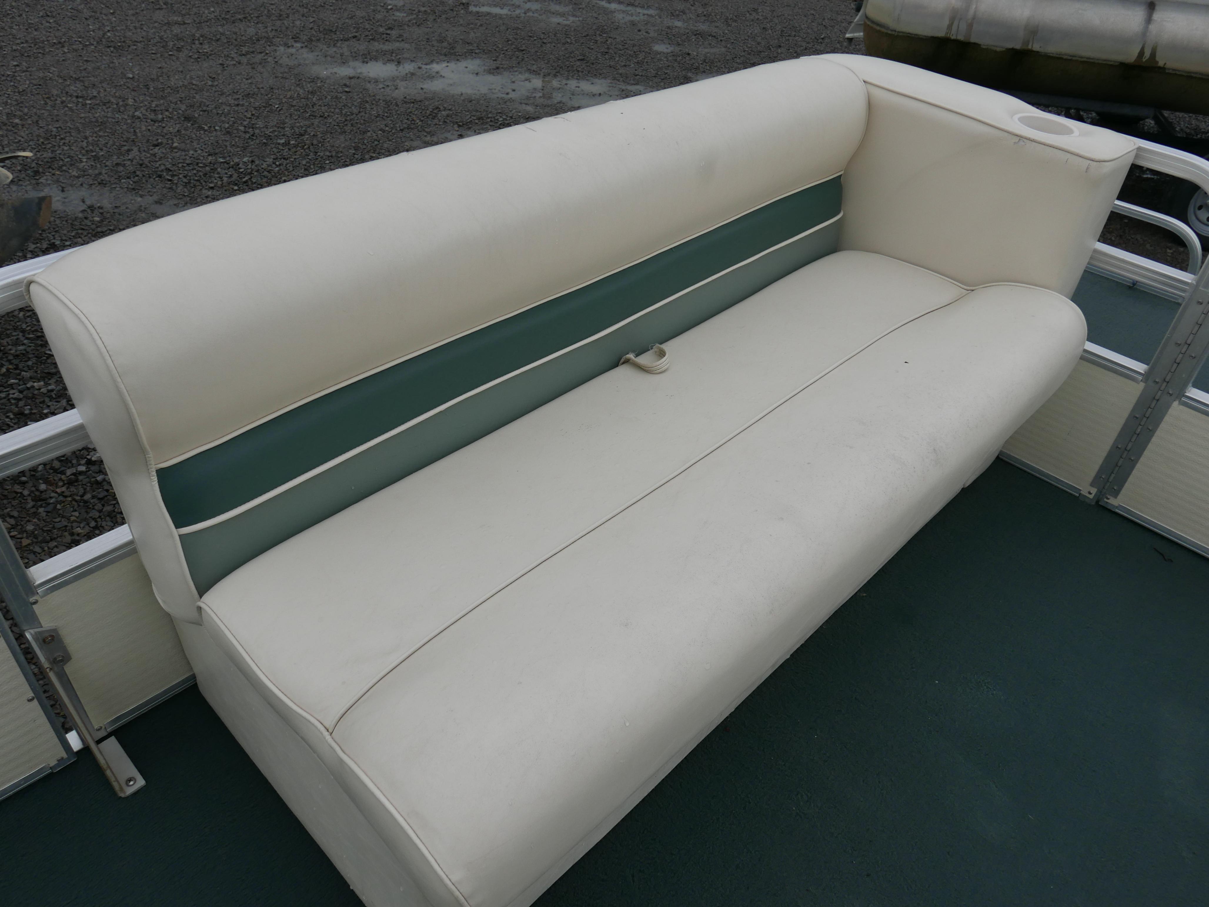 Slide: The Image of White and green seating on 2000 Riviera Cruiser pontoon boat. - 5