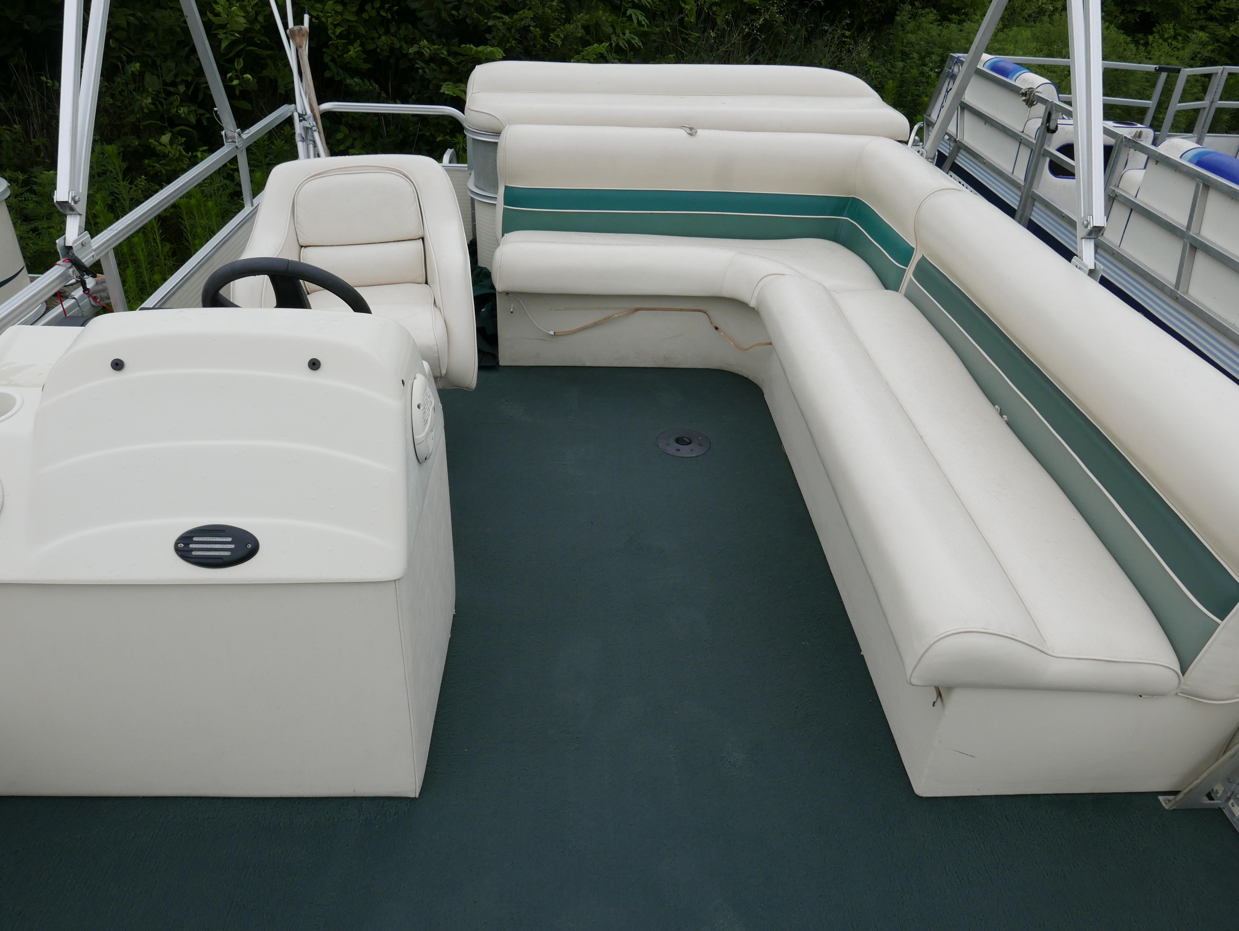 Slide: The Image of Pontoon boat interior with white seating, Riviera Cruiser Cruise 2000 model. - 9