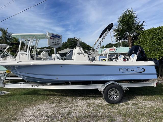 Slide: The Image of 2024 Robalo 206 Cayman boat on a trailer, displayed outdoors. - 1