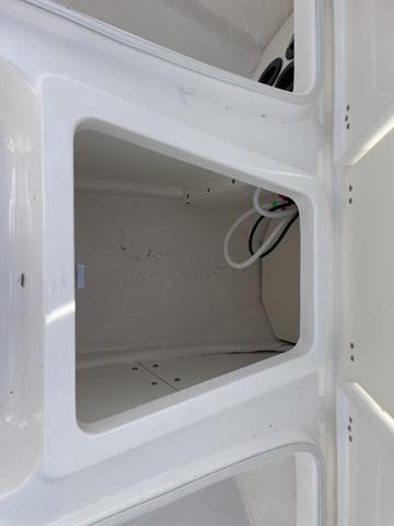 Slide: The Image of 2024 Robalo 206 Cayman storage compartment. - 29