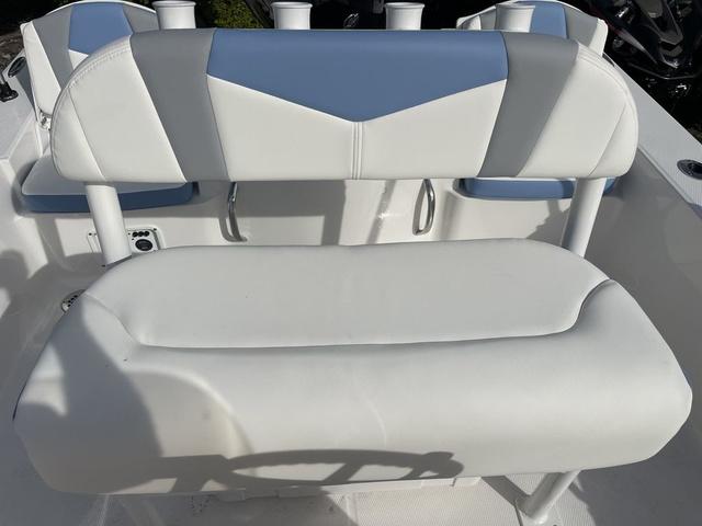 Slide: The Image of 2024 Robalo 206 Cayman boat seating with white and gray upholstery. - 33