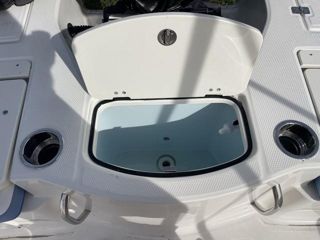 Slide: The Image of 2024 Robalo 206 Cayman boat livewell and cup holders. - 37
