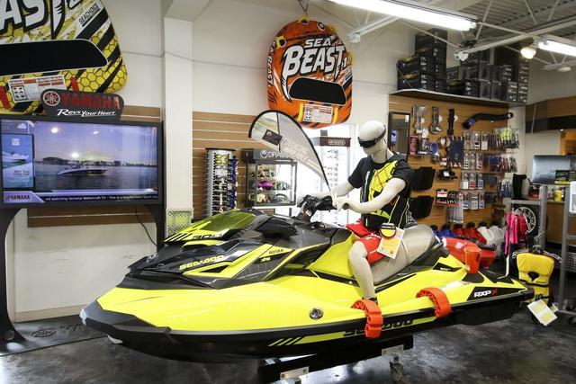 Slide: The Image of Showroom display of a 2024 Robalo 206 Cayman boat with accessories. - 42