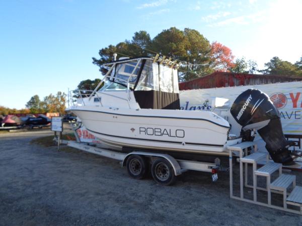 Slide: The Image of 2000 Robalo 2240 Walkaround boat on trailer with Mercury outboard motor. - 1