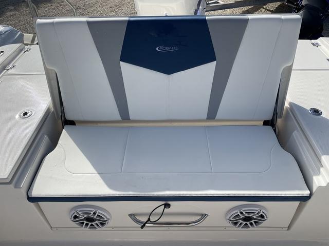 Slide: The Image of 2023 Robalo 266 Cayman boat seat with built-in speakers and storage. - 10