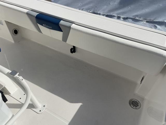 Slide: The Image of 2023 Robalo 266 Cayman boat interior, white seating and storage area. - 13
