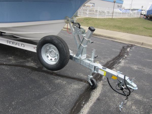 Slide: The Image of 2024 Robalo R180 Center Console boat trailer hitch and wheel. - 17