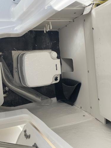 Slide: The Image of 2024 Robalo R222 Explorer boat interior with compact marine toilet. - 20
