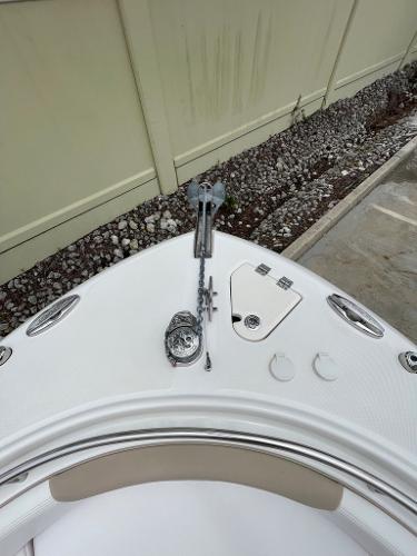 Slide: The Image of 2019 Robalo R242 Center Console boat bow with anchor and storage compartments. - 21
