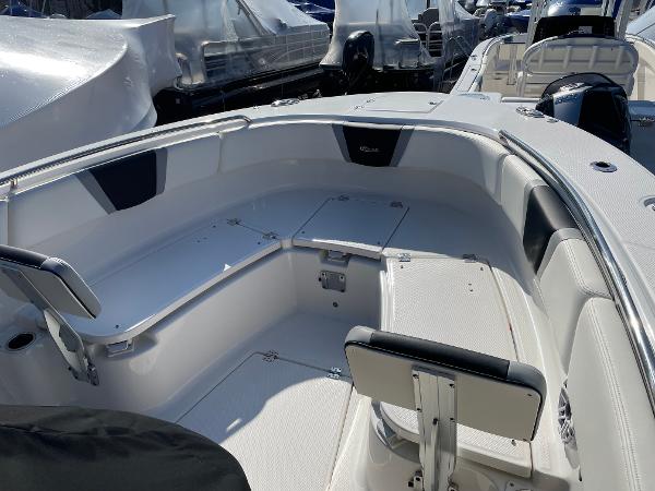 Slide: The Image of 2024 Robalo R270 Center Console boat interior with seating and storage. - 10