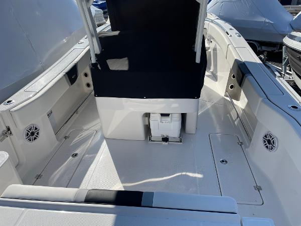 Slide: The Image of 2024 Robalo R270 Center Console boat interior with seating and storage. - 5
