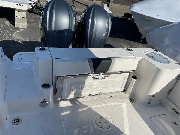 Slide: The Image of 2024 Robalo R270 Center Console boat with dual engines and spacious deck. - 6