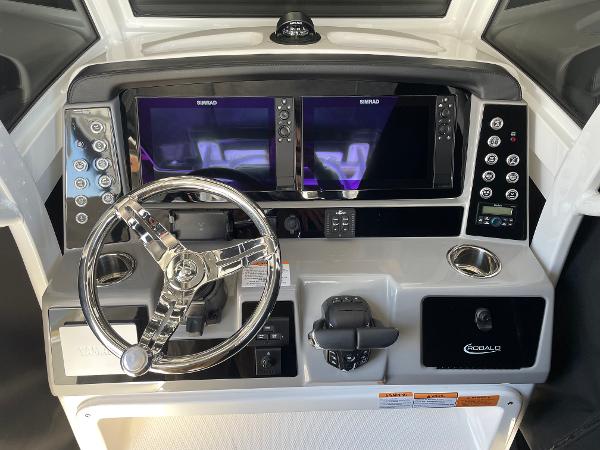 Slide: The Image of 2024 Robalo R270 Center Console dashboard with dual Simrad displays and modern controls. - 7